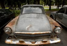 Rusty car being sold as a certified pre-owned chevy
