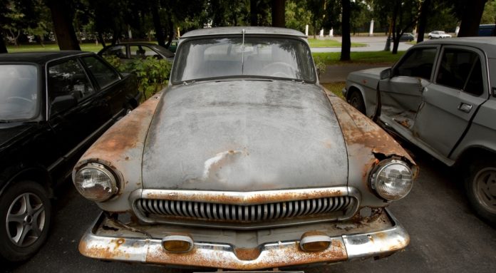 Rusty car being sold as a certified pre-owned chevy