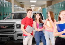 White 2019 GMC Terrain in school hallway behind 4 students, one crying