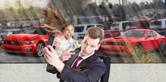 Car salesman taking selfie, Red 2018 Ford Mustang and Red 2018 Dodge Challenger, asian weather woman in background