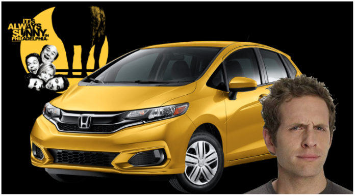 Yellow Honda Fit with Always Sunny in Philadelphia logo and Dennis' face