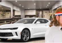 White 2019 Chevy Camaro in hair salon with man with mullet