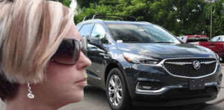 Woman with "can I speak to the manager" hairstyle in front of 2019 Buick Enclave