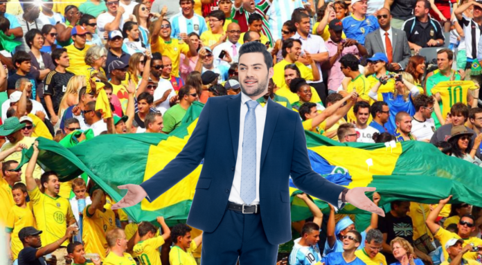 A man in a suit in front of a Brazilian crowd