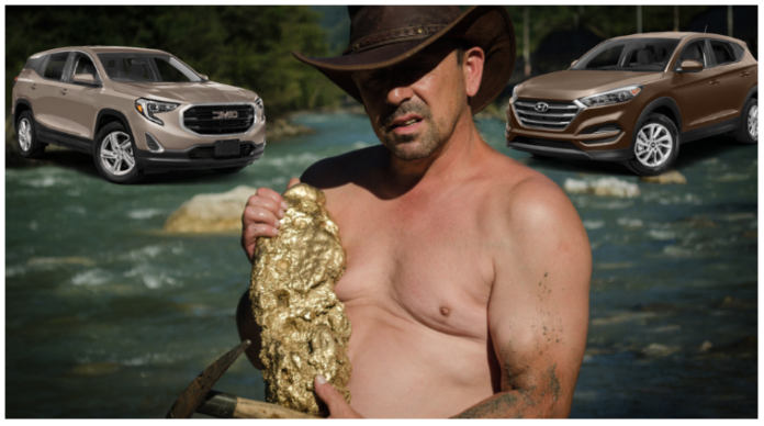 A shirtless gold prospector comparing two SUVs
