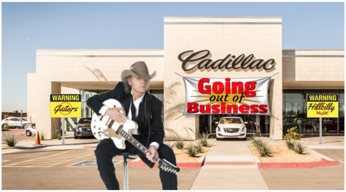 A country singer sits in front of a closing Cadillac dealership