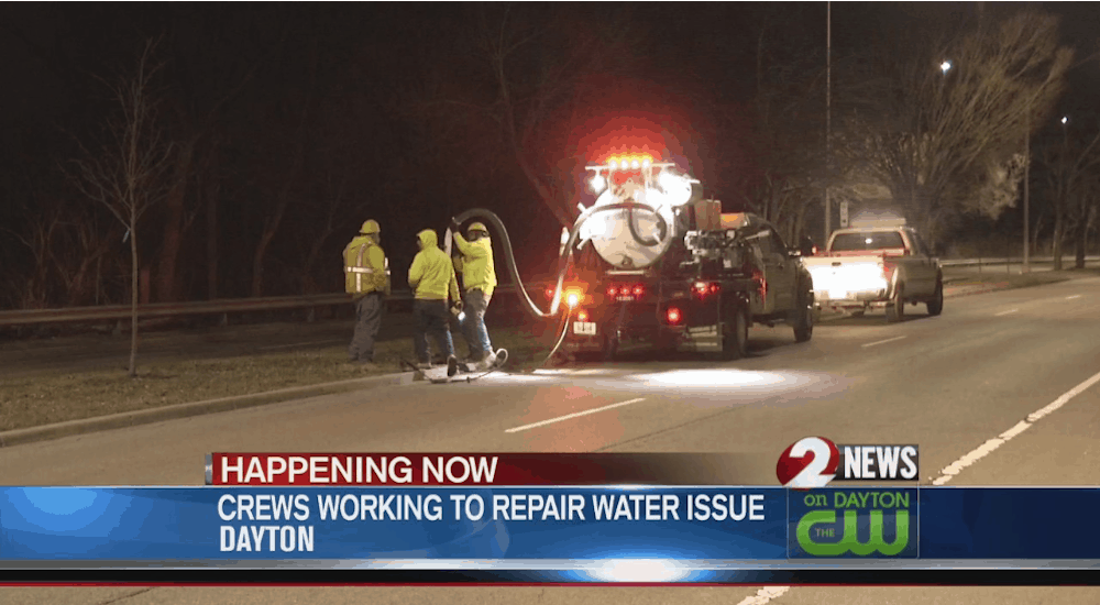 Water issue crew at night in news image