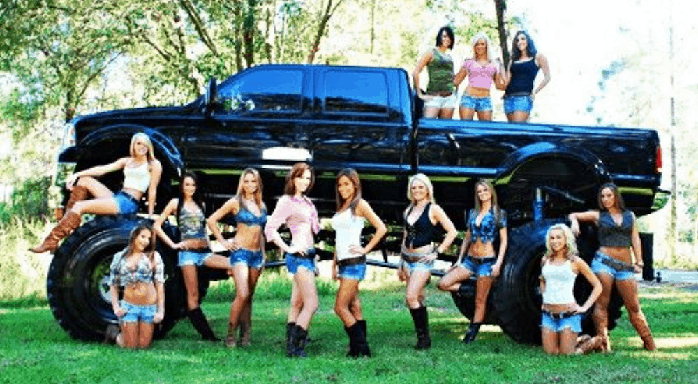Bridal party in front of lifted truck with limited clothing