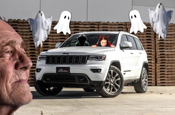 An old man's face is shown in front of a Jeep Grand Cherokee with haunted characters around it. He wishes he compared the 2019 Buick Enclave vs 2019 Jeep Grand Cherokee better.