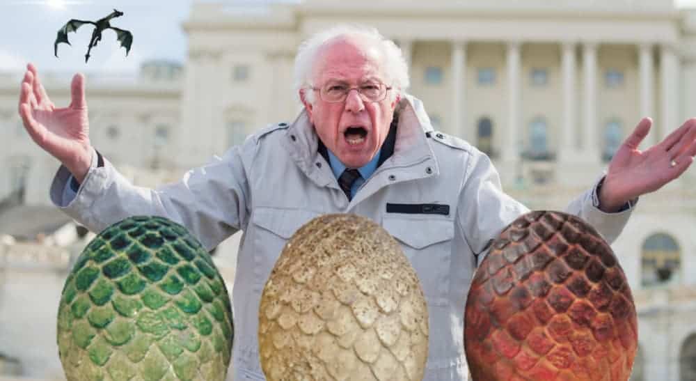 Bernie Sanders is shown yelling with his hands up behind three dragon eggs.