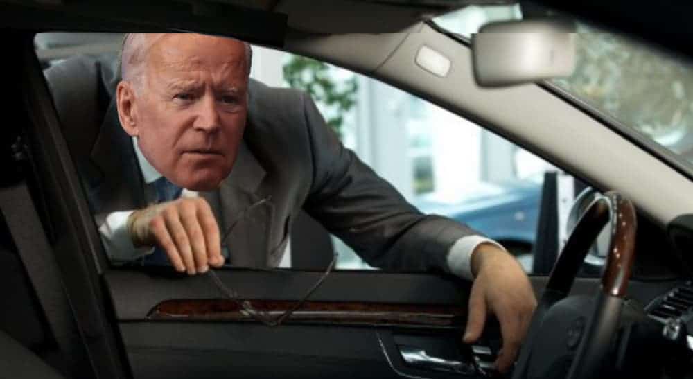Joe Biden is leaning into a car window.
