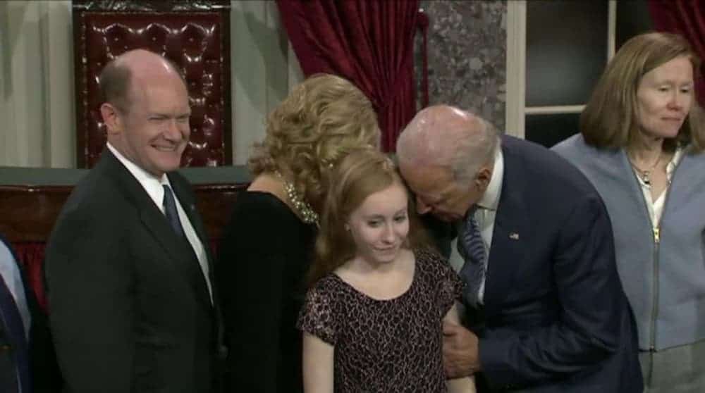 Joe Biden is making a younger girl uncomfortable at an event.