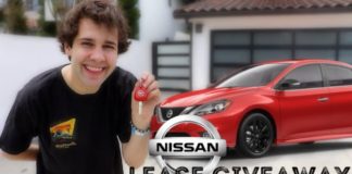 A young man is holding keys in front of his garage with a red Nissan sedan and a Nissan Lease Giveaway text over laid.