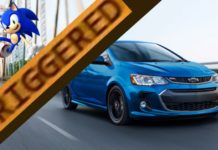 A blue Chevy Sonic, apparently not popular among Chevy used cars, is driving on a bridge with a cartoon Sonic the Hedgehog and the word 'triggered' over laid.