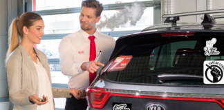 Vaping Car Salesman Pitching a Prospective CarBuyer on a KIA Covered with Pro-Vaping Bumper Stickers