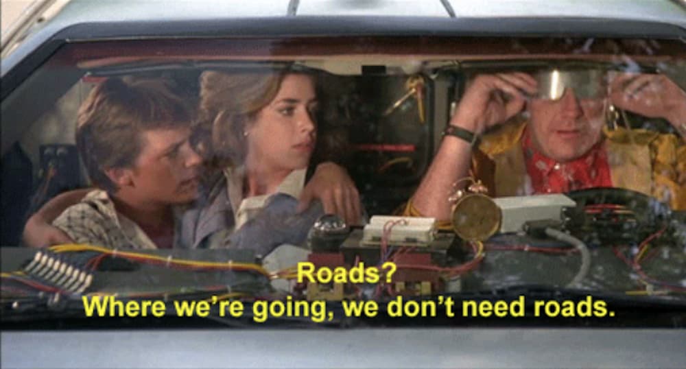 A screenshot from Back to the Future shows the characters inside the car.