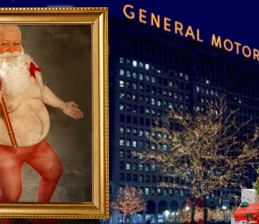 A framed photo of a shirtless Santa giving the middle finger is shown in front of the GM building to help compare the 2020 Chevy Silverado 1500 vs 2020 Toyota Tundra.