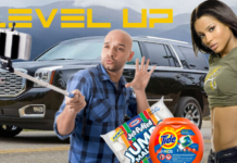 A GMC SUV is parked with Ciara, Level Up, Tide Pods, marshmallows, and a man with a selfie-stick in front of it.