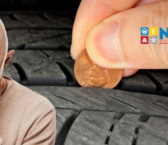 A bald man labeled 'masshole' is crying with a discount tire's tread being checked by a penny behind him.
