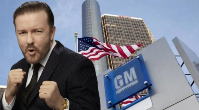 Ricky Gervais is putting his fists up next to the GM building, which may help those looking for used cars in Albany, NY.