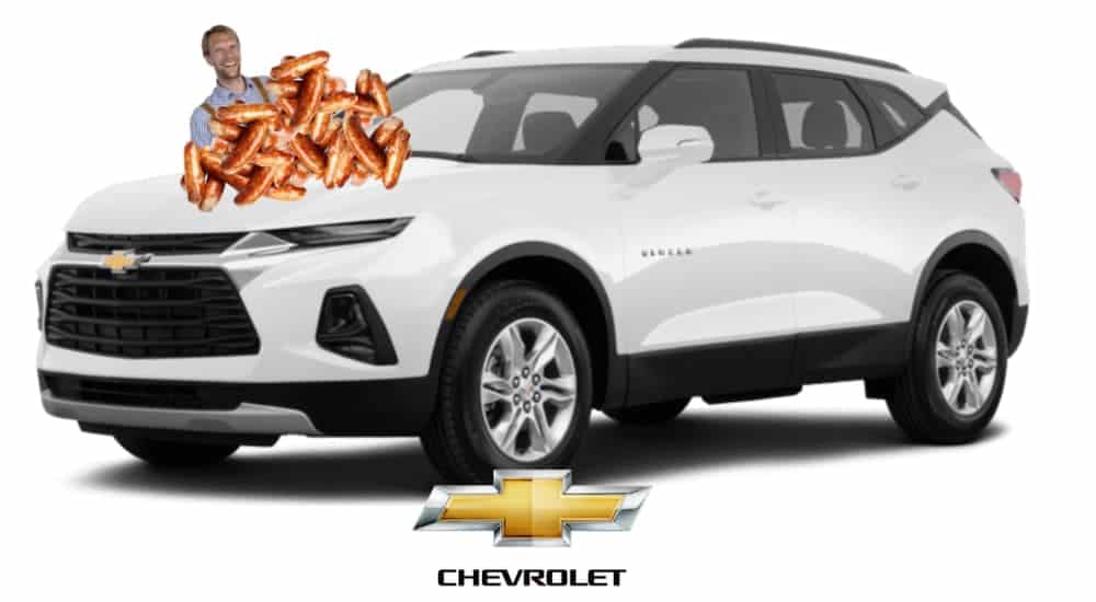 Sausages are on the hood of a white 2020 Chevy Blazer.