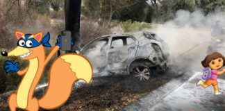 Swiper and Dora are next to a crashed car to help people decide between the 2020 Ford Explorer vs 2020 Chevy Traverse.