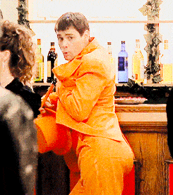 A gif of Lloyd in an orange suit from Dumb and Dumber is shown.