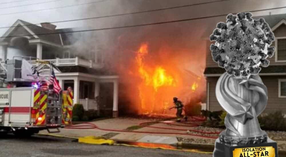 An Isolation All-Star Award is in front of a house fire.