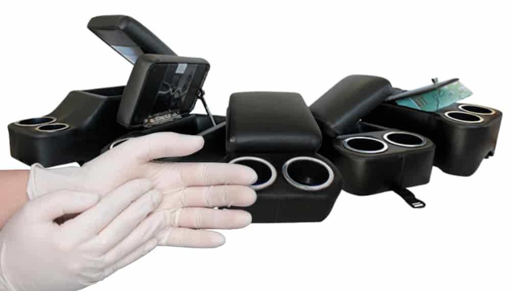 Gloved hands are in front of multiple center consoles.