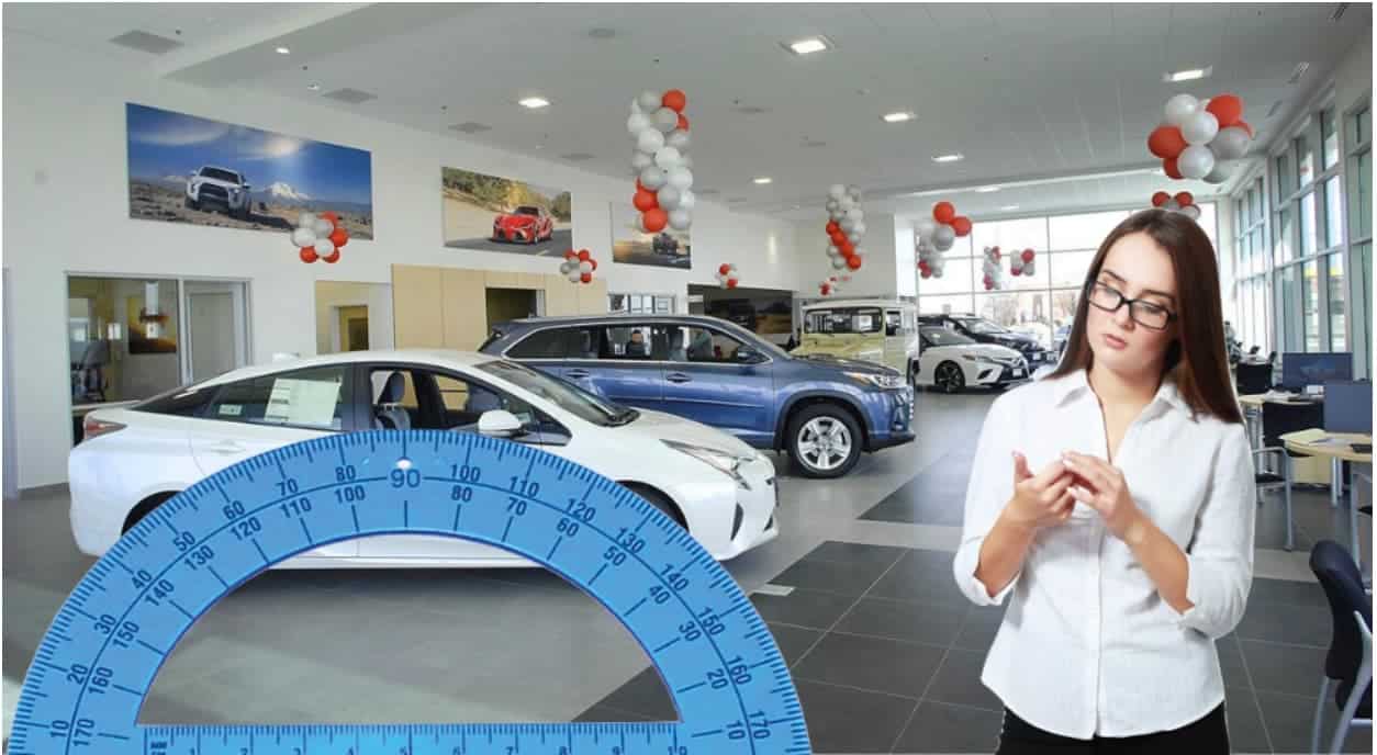 A protractor and a woman are in a used ford dealership.