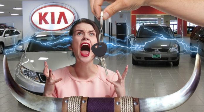A woman is screaming at a Kia dealership showing bull horns and electricity.