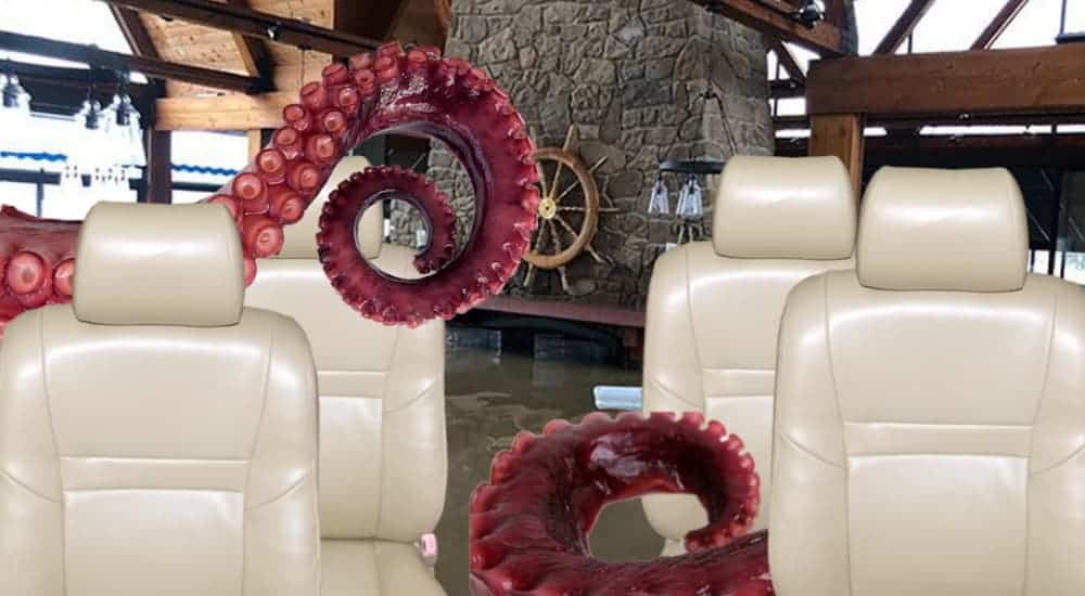 The tan interior of a 2021 Kia Sorento with squid tentacles and a captains wheel.