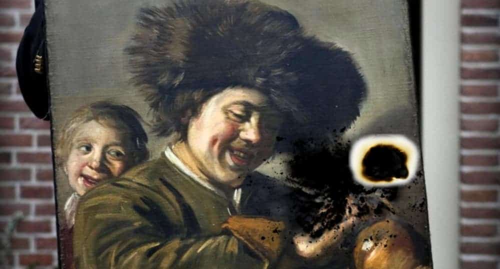 A burnt painting shows a man with a lot of dark hair smiling, with a child behind him.