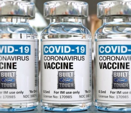 A close up is shown of multiple Covid-19 vaccine vials.