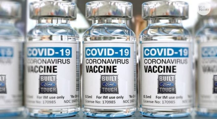 A close up is shown of multiple Covid-19 vaccine vials.