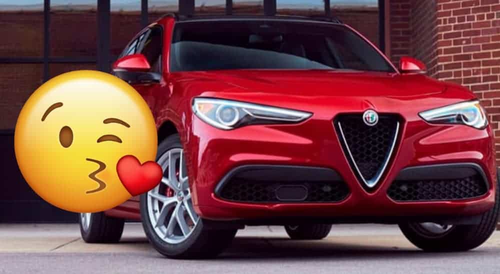 A kissing face emoji is next to a red Alfa Romeo.