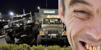 A man 's face with gold teeth is in front of a Jeep dealer in California.