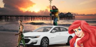 A white 2021 Chevy Malibu is shown on the beach next to Ariel, The Deep, and Aquaman.