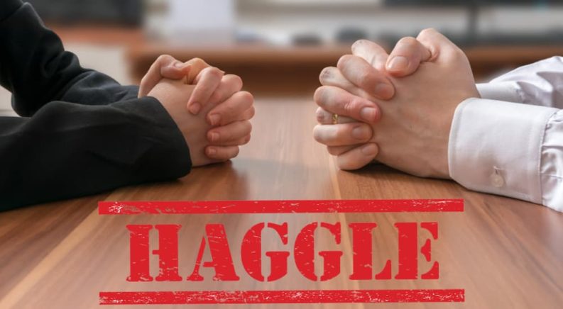 Two sets of hands are folded on a table above text that says haggle.