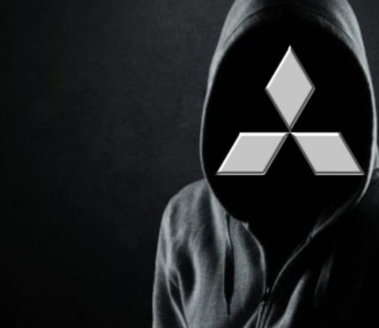 A hooded figure is shown with a Mitsubishi logo for a face, after leaving a used car dealer near you.