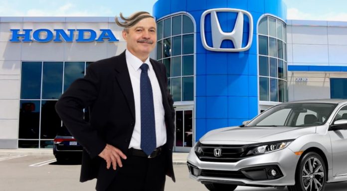 Mark Bobkins is standing in front of a Honda dealership with a silver 2021 Honda Civic.