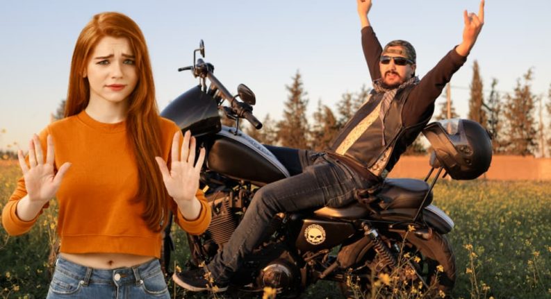 A woman has her hands up to say 'no' in front of a man on a motorcycle doing the 'rock on' hands.