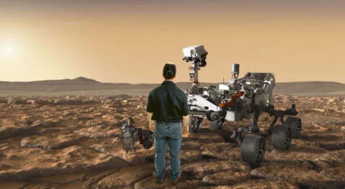 A man is shown standing on Mars in front of the NASA rover.