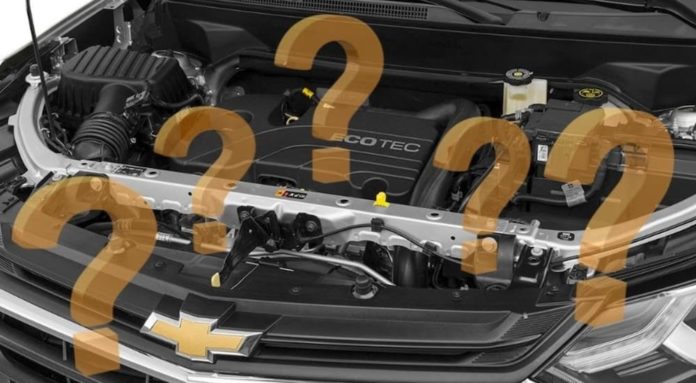 The engine of a Chevy Equinox is shown with question marks at your local used car lot.