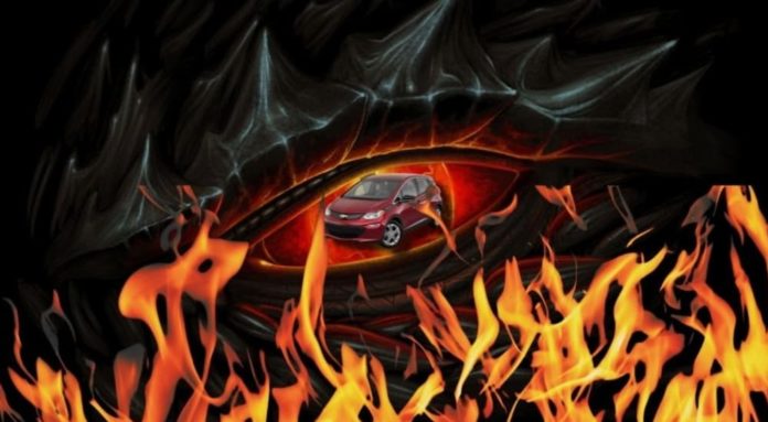 A red 2021 Chevy Bolt EV is shown surrounded by flames.