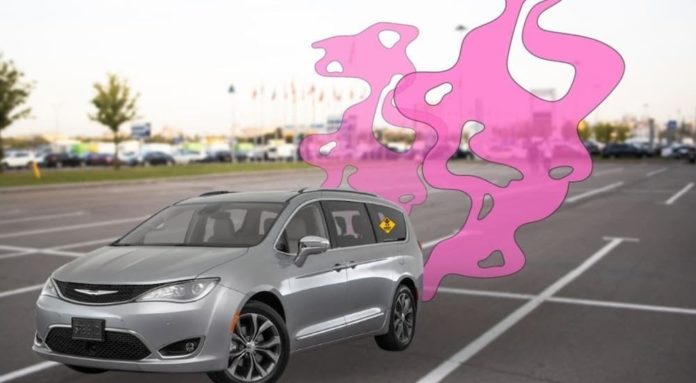 A grey used Chrysler Pacifica is shown with pink smoke coming out of the exhaust.