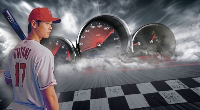 Shohei Ohtani is show standing at an Illinois pre-owned Toyota dealership.