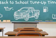 A classroom chalkboard shows a drawing of a 2022 Chevy Colorado.
