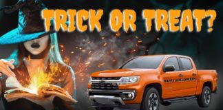 An orange 2022 Chevy Colorado is shown next a witch and the words 'trick or treat.'