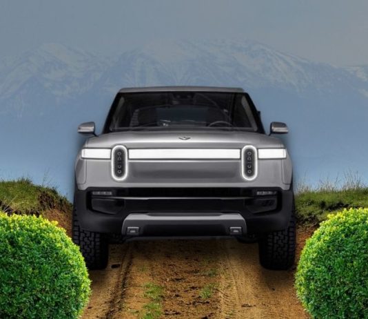 A silver Rivian R1T is shown from the front.